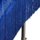 Close view of the stoned neckline above the blue spiral fringe