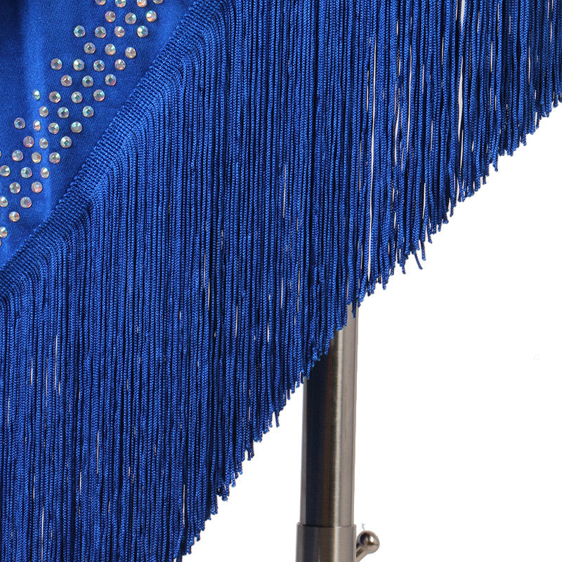 Close view of the stoned neckline above the blue spiral fringe