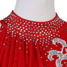 Close view of the silver applique packed with rhinestones on red