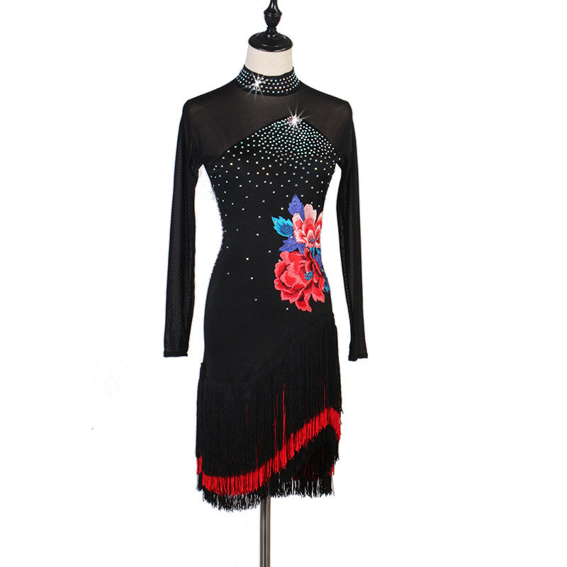 Black latin dance dress angled view with the peony applique and red fringe
