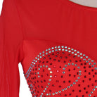 Close view of the crystal heart swirl motif on red
