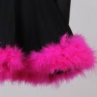Close view of the pink marabou feather trim at the hem