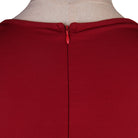 Close view of the zip fastening at the back neckline
