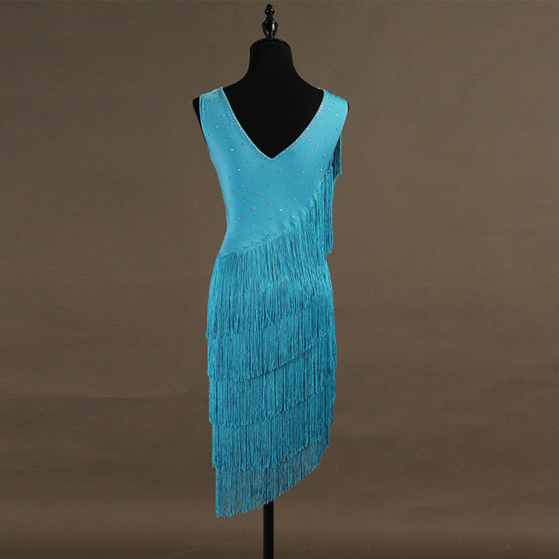 Turquoise spiral fringe latin dance dress side view showing the fringe wind