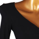 Close view of the shoulder seam and long sleeve on the ruched dress