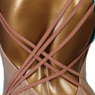 Close view of the crossed strap back over the nude panel