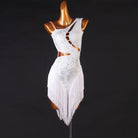 White latin dance dress with crystal outlined ladder cutouts and diagonal fringe