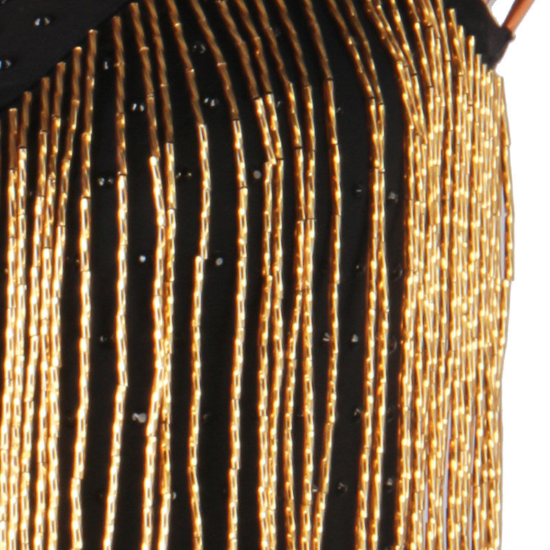 Close view of the gold bugle bead fringe strands