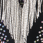 Close view of the silver fringe strands over the crystal edging