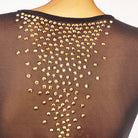 Close view of the gold studs scattered across the sheer mesh back