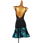 Black latin dance dress rear view showing the turquoise flounce and low back