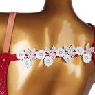 Close view of the lace flower trim across the back strap