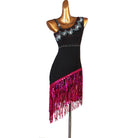 Black latin dance dress with rose sequin fringe falling from a diagonal hip seam