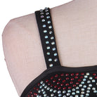 Close view of the studded straps and crystal neckline spray