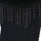 Close view of the beaded fringe strands over the stoned bodice