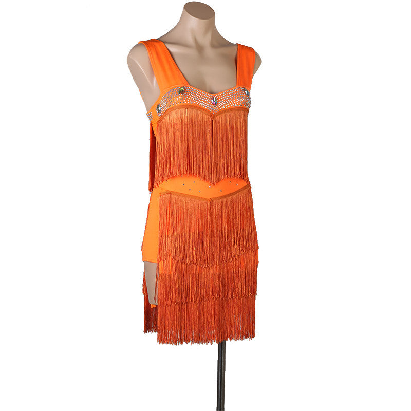 Orange fringe latin dance dress angled view showing the nude mesh waist