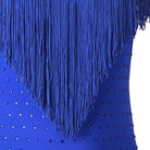 Close view of the blue fringe strands over the stone scattered fabric