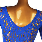 Close view of the amber and clear stones set across the blue shoulder