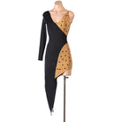 Black and nude stone panel latin dance dress angled view with the pointed hem
