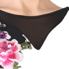 Close view of the raised peony embroidery against the mesh yoke