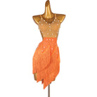 Orange latin dance dress with pearl set nude mesh yoke and petal fringe hem