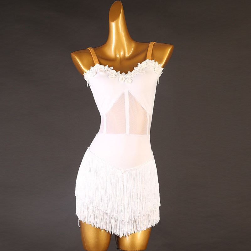 White latin dance dress with lace trimmed neckline and fringe wrap hem