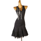 Black latin dance dress with hanging bead strands and pleated ruffle hem