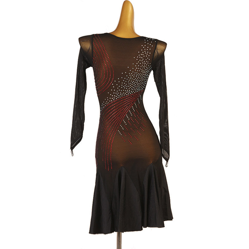 Sheer black stone swirl latin dance dress angled view with the fluted hem
