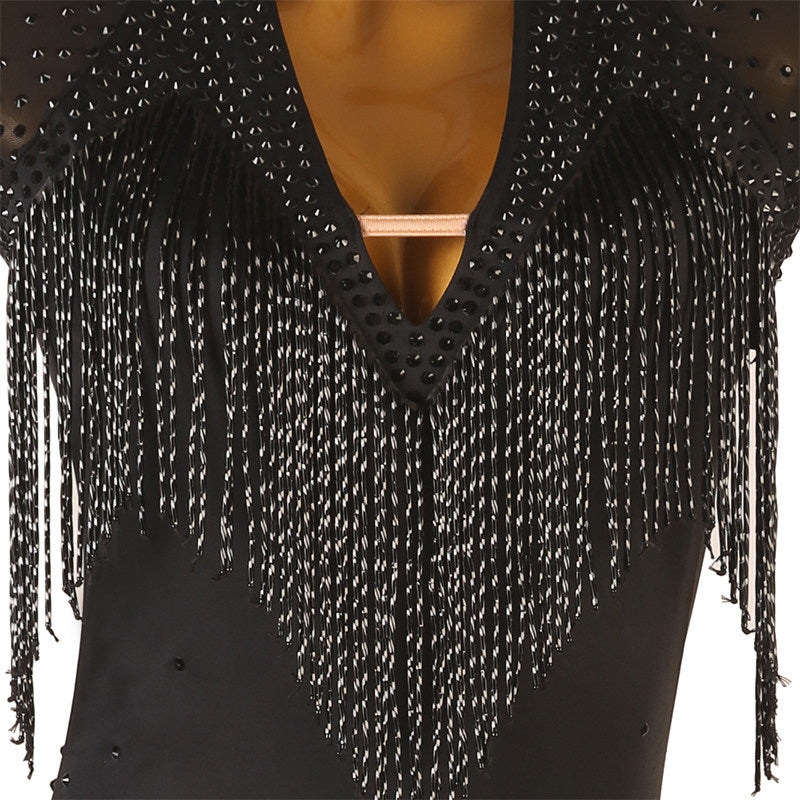 Close view of the bead fringe hanging over the plunging neckline