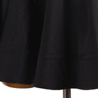 Close view of the black circle skirt hem