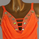 Close view of the jewels set into the strap ladder at the neckline