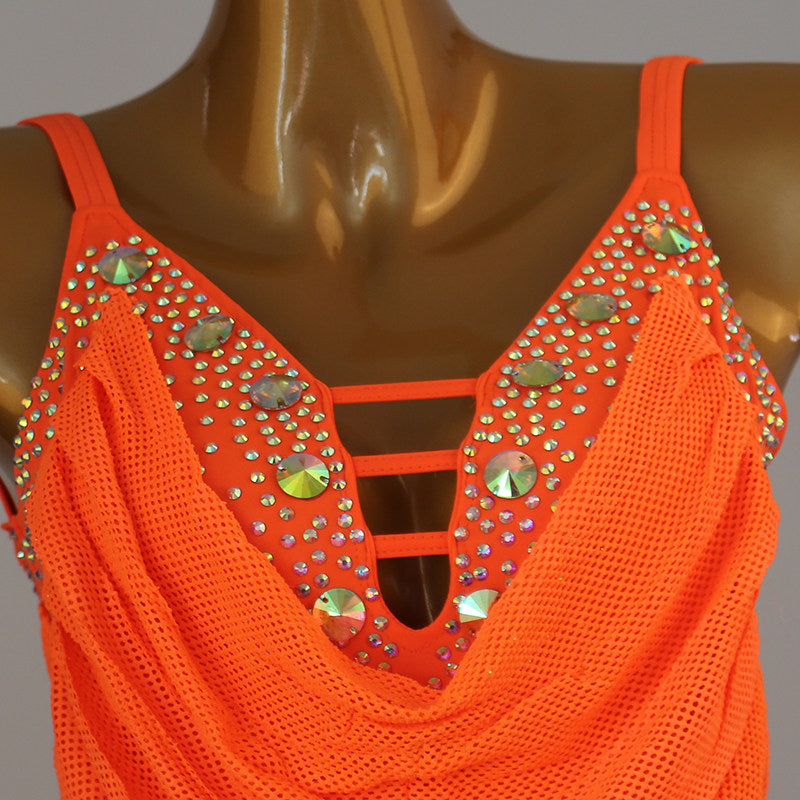 Close view of the jewels set into the strap ladder at the neckline