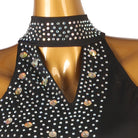 Close view of the stones packed into the V bib on sheer mesh