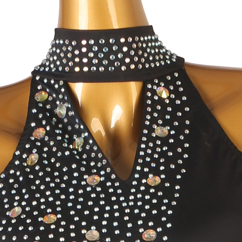 Close view of the stones packed into the V bib on sheer mesh