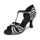 zebra print latin dance shoe for women with a T-strap over a knotted vamp, crystal buckle and flared heel